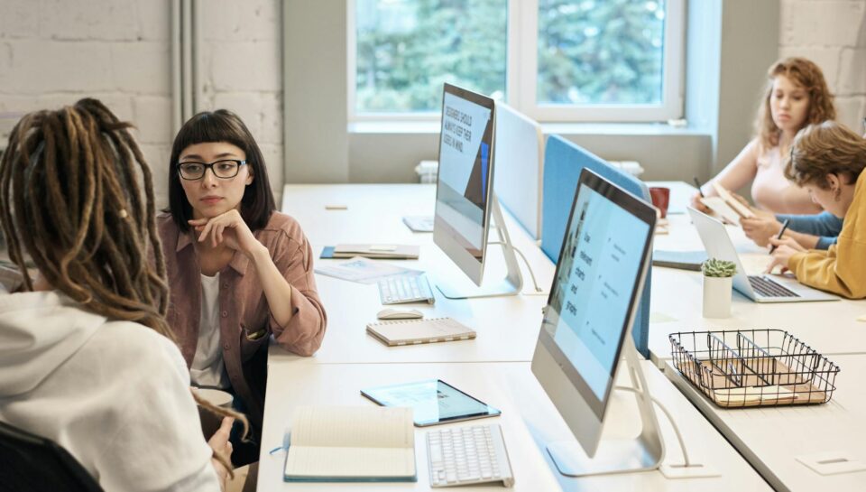 people in front of the computers